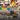 Collage of children playing with toys including trucks, water, and animals in sand play trays with a Hardys brand logo.