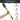 Adjustable length garden trowel with hand holding it, features listed on a white background.