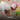 Child playing in sand with toys, emphasizing cleanliness with 'Triple Washed' text.