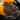 Hand wearing an orange gardening glove holding soil with text about Acid-Tailored pH.