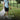Person using a litter picker tool with text highlighting convenience and features on a grassy background