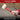 Red and black rubber mallet held by a person with text about professional quality and durability.