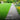 Pathway through a garden with green grass and flowers, featuring text about enhancing soil.