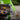 Split shot of green weed burner used to light a grill, and being used to kill weeds on a pavement with text about temperature settings. Text reads 80 degree setting' and '600 degree setting'.