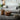 Modern living room with a gray sofa, wooden coffee table, and decorative items. Text about suitability for the brush in a home setting.