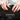 Hands holding dark soil with text 'Screened for Quality' and benefits listed.