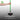 Hand holding a green long-handled edger with text on a gray background