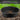 Black compost sieve with compost material on a green blurred background