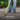 Person using a green weed burner on a sidewalk with text 'Eliminates Weeds' and description.