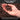 Hand holding premium expanded clay pebbles with product description text.