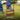 Close in shot of a person using a red lawn aerator with wide footplate on a grass lawn