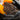 Hand wearing orange gardening gloves holding soil mixed with vermiculite with text about nutrient retention.