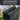 Black drying rack with text highlighting its use for mixed loads on a blurred outdoor background.