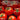 Close in shot of tomatoes piled up with a light spray of water over the top. Text on screen describes the grow bag suitability for new and experienced gardeners.