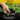 Hand holding soil with a blurred green background, featuring 'Organic Base' branding.