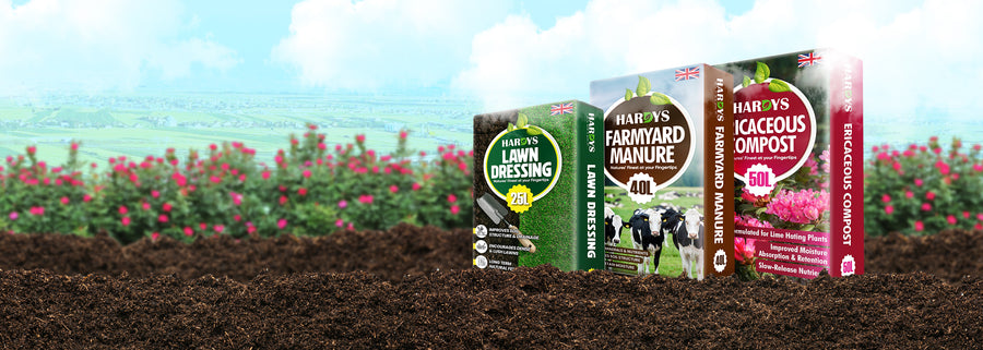 Hardys compost products displayed on a field with flowers in the background