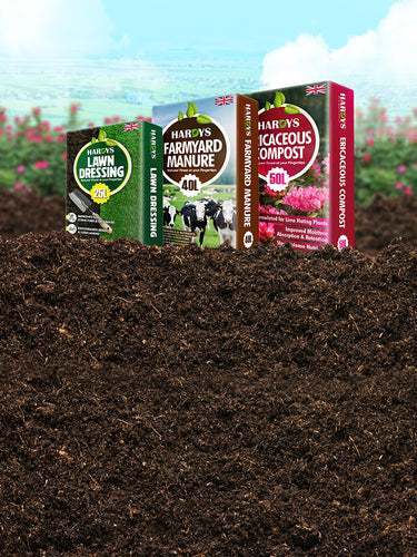 Hardys compost products on a field with a blurred garden background