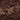 Close-up shot of rich, dark brown coloured compost soil.